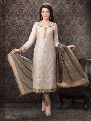 Add This Lovely Rich And Elegant Looking Silk Based Designer Straight Suit To Your Wardrobe In Cream Color. Its Top Is Fabricated On Chanderi Silk Paired With Cotton Silk Based Bottom And Art Silk Dupatta.