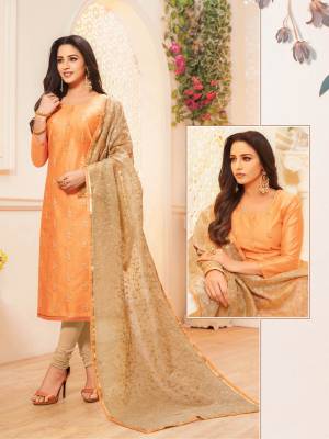 Grab This Pretty Designer Straight Suit To Your Wardrobe In Orange Colored Top Paired With Beige Colored Bottom And Dupatta. This Pretty Top Is Fabricated On Modal Silk Paired With Cotton Bottom And Net Fabricated Dupatta. 
