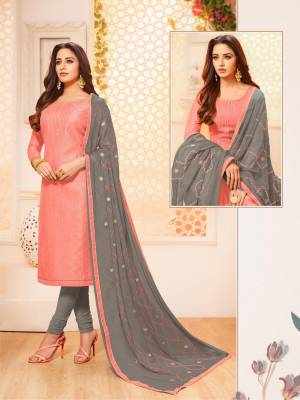 Flaunt Your Rich And Elegant Taste In This Designer Straight Suit In Dark Peach Colored Top Paired With Contrasting Dark Grey Colored Bottom And Dupatta. Its Top Is Silk based Paired With Cotton Bottom And  Chiffon Fabricated Dupatta. 
