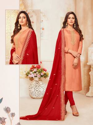 Flaunt Your Rich And Elegant Taste In This Designer Straight Suit In Light Orange Colored Top Paired With Contrasting Red Colored Bottom And Dupatta. Its Top Is Silk based Paired With Cotton Bottom And  Soft  Silk Fabricated Dupatta. 