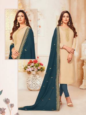 Flaunt Your Rich And Elegant Taste In This Designer Straight Suit In Beige Colored Top Paired With Contrasting Prussian Blue Colored Bottom And Dupatta. Its Top Is Silk based Paired With Cotton Bottom And Soft Silk Fabricated Dupatta. 