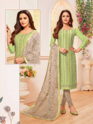 Simple And Elegant Looking Suit Here In Light Green Colored Top Paired With Grey Colored Bottom And Dupatta. Its Top Is Modal Silk Based Paired With Cotton Bottom And Orgenza Fabricated Embroidered Dupatta. Buy This Designer Straight Suit Now. 