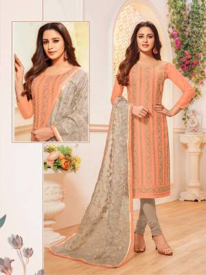 Simple And Elegant Looking Suit Here In Dark Peach Colored Top Paired With Grey Colored Bottom And Dupatta. Its Top Is Modal Silk Based Paired With Cotton Bottom And Orgenza Fabricated Embroidered Dupatta. Buy This Designer Straight Suit Now. 