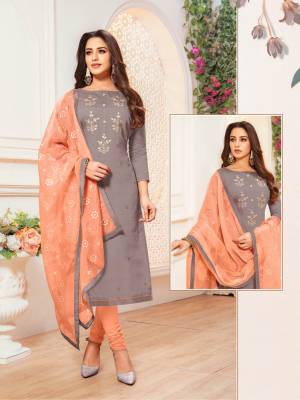 For Your Semi-Casual Wear Grab This Pretty Straight Cut Suit In Dark Grey Colored Top Paired With Dark Peach Colored Bottom And Dupatta. Its Top And Bottom Are Cotton Based Paired With Net Fabricated Dupatta. Buy Now.