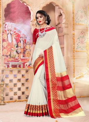Celebrate This Festive Season Wearing This Pretty elegant Looking Saree In White And Red Color Paired With A Lovely Red Colored Blouse. This Saree And Blouse Are Khadi Silk Based Which Also Gives a Rich And Elegant Look To Your Personality.