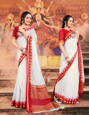 Celebrate This Festive Season Wearing This Pretty elegant Looking Saree In White And Red Color Paired With A Lovely Red Colored Blouse. This Saree And Blouse Are Khadi Silk Based Which Also Gives a Rich And Elegant Look To Your Personality.