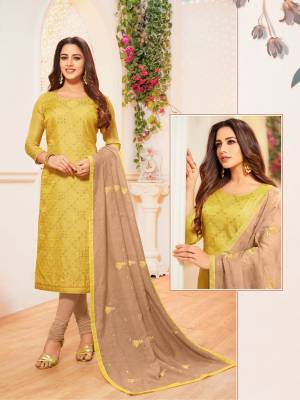 Here Is A Rich And Elegant Looking Designer Straight Suit In Pear Green Colored Top Paired With Beige Colored Bottom And Dupatta. Its Top Is Fabricated On Soft Silk Paired With Cotton Bottom And Modal Silk Dupatta. 