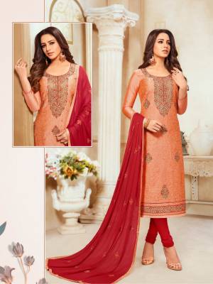 Grab This Pretty Designer Straight Suit In Orange Colored Top Paired With Contrasting Red Colored Bottom And Dupatta. Its Top Is Modal Silk Based Paired With Cotton Bottom And Chiffon Fabricated Dupatta.