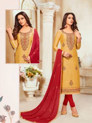 Grab This Pretty Designer Straight Suit In Musturd Yellow Colored Top Paired With Red Colored Bottom And Dupatta. Its Top Is Modal Silk Based Paired With Cotton Bottom And Chiffon Fabricated Dupatta.