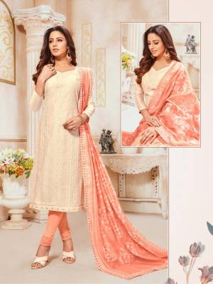 Simple And Elegant Looking Designer Straight SuitIs Here In Off-White Colored Top Paired With Peach Colored Bottom And Dupatta. Its Top and Dupatta Are Modal silk Based Paired With Cotton Bottom. 