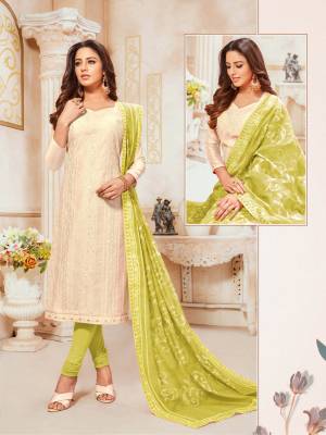 Simple And Elegant Looking Designer Straight SuitIs Here In Off-White Colored Top Paired With Light Green Colored Bottom And Dupatta. Its Top and Dupatta Are Modal silk Based Paired With Cotton Bottom. 