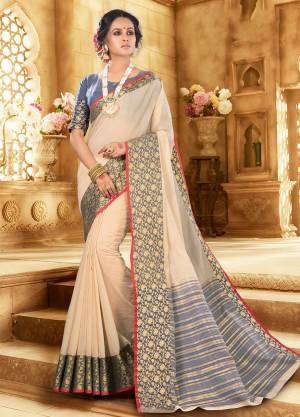 Flaunt Your Rich And Elagant Taste Wearing This Pretty Attractive Saree In Off-White Color Paired With Contrasting Dark Grey Colored Blouse. This Saree And Blouse Are Fabricated On Khadi Silk Which Also Gives A Rich Look To Your Personality. Buy Now.