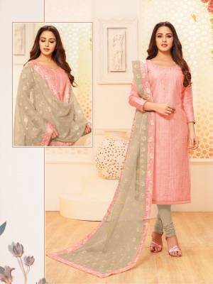 Here Is A Pretty Designer Straight Suit For Your Semi-Casual Wear In Light Pink Color Paired With Grey Colored Bottom And Dupatta. Its Top IS Fabricated On Modal Silk Paired With Cotton Bottom And Net Fabricated Dupatta.