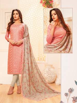 Celebrate This Festive Season With Beauty And Comfort In This Very Pretty Designer Suit In Light Peach Color Paired With Pale Grey Colored Bottom And Dupatta. Its Top Is Satin Silk Based Paired With Cotton Bottom And Digital Printed Dupatta. 