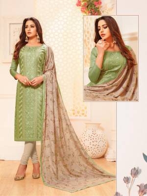 Celebrate This Festive Season With Beauty And Comfort In This Very Pretty Designer Suit In Light Green Color Paired With Pale Grey Colored Bottom And Dupatta. Its Top Is Satin Silk Based Paired With Cotton Bottom And Digital Printed Dupatta. 
