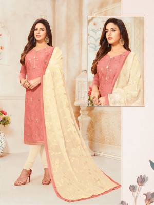 Here Is A Pretty Designer Straight Suit For Your Semi-Casual Wear In Dark Peach Color Paired With Off-White Colored Bottom And Dupatta. Its Top IS Fabricated On Modal Silk Paired With Cotton Bottom And Chiffon Fabricated Dupatta.