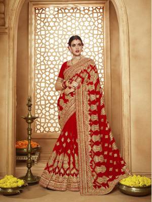 Here Is A Very Attractive Heavy Designer Bridal Saree For The Upcoming Wedding Season In Red Color Paired With Embroidered Red Colored Blouse. It Is Beautified With Heavy Jari Embroidery With Stone Work. Buy This Lovely Bridal Saree Now.