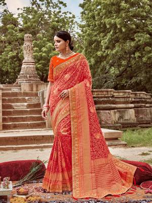 Here Is A Very Pretty Heavy Designer Saree. This Beautiful Red Colored Heavy Embroidered Saree Is Fabricated On Jacquard Silk Paired With An Embroidered Orange Colored Art Silk Fabricated Blouse. Buy This Pretty Saree Now.