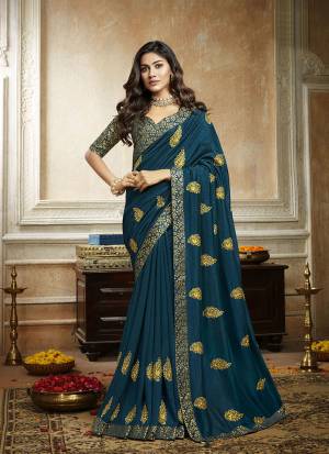 Grab This Pretty Attractive Saree In Blue Color. This Saree Is Fabricated On Soft Art Silk Paired With Brocade Fabricated Blouse. It Has Attractive Jari Embroidered Motifs Highlited With Stone Work. Its Rich Fabric And Color Will Earn You Lots Of Compliments From Onlookers.