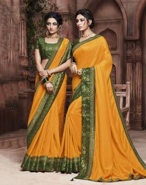 Grab This Pretty Attractive Saree In Musturd Yellow Color Paired With?Contrasting Dark Green Colored Blouse. This Saree Is Fabricated On Soft Art Silk Paired With Brocade Fabricated Blouse. Its Rich Fabric And Color Will Earn You Lots Of Compliments From Onlookers.?