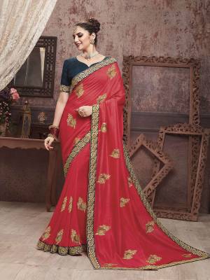 Celebrate This Festive Season With Beauty And Comfort In This Motif Embroidered Yet Elegant Saree In Crimson Red Color Paired With Contrasting Navy Blue Colored Blouse. This Saree And Blouse are Silk Based Which Gives A Rich Look To Your Personality. 