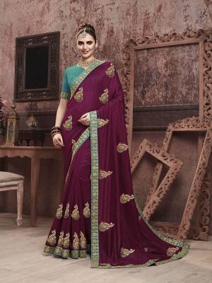 Add This Very Beautiful And Attractive Looking Designer Saree In Wine Color Paired With Contrasting Blue Colored Blouse. This Saree Is Fabricated On Soft Art Silk Paired With Art Silk Fabricated Blouse. It Is Beautified With Embroidered Motifs Giving An Elegant Look To The Saree. 
