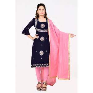 If Those Readymade Suit Does Not Lend You The Desired Comfort Than Grab This Simple Dres Material In Navy Blue Georgette Based Top Paired With Pink Colored Cotton Fabricated Bottom And Chanderi Dupatta. 