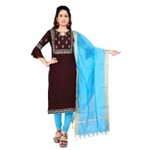 Grab This Pretty Simple Dress Material In Brown Colored Top Paired With Contrasting Sky Blue Colored bottom And Dupatta. Its Embroidered Top Is Georgette Based Paired With Cotton Bottom And Chanderi Dupatta. Buy This Dress Material Now. 