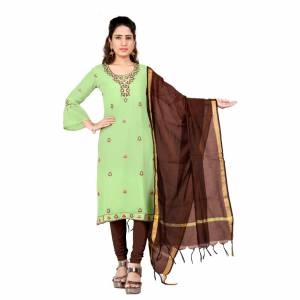 Grab This Pretty Simple Dress Material In Green Colored Top Paired With Contrasting Brown Colored bottom And Dupatta. Its Embroidered Top Is Georgette Based Paired With Cotton Bottom And Chanderi Dupatta. Buy This Dress Material Now. 