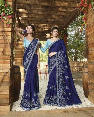 Here Is A Rich Silk Based Designer Saree In Royal Blue Color Paired With Sky Blue Colored Blouse. This Pretty Saree Is Beautified With Detailed Embroidery Giving An Attractive Look. 