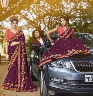 Add This Very Beautiful And Attractive Looking Designer Saree In Purple Color Paired With Contrasting Peach Colored Blouse. This Saree And Blouse Are Silk Based Beautified With Attractive Work. 