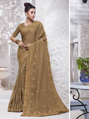 Enhance Your Personality Wearing This Designer Saree In Beige Color. This Pretty Resham Embroidered Saree Is Fabricated On Chiffon Paired With Art Silk Fabricated Blouse. It Is Highlited With Pretty Stone Work Which Gives An Attractive Yet Elegant Look. 