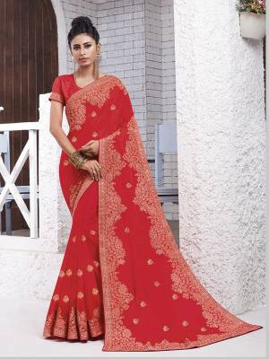 Enhance Your Personality Wearing This Designer Saree In Crimson Red Color. This Pretty Resham Embroidered Saree Is Fabricated On Chiffon Paired With Art Silk Fabricated Blouse. It Is Highlited With Pretty Stone Work Which Gives An Attractive Yet Elegant Look. 