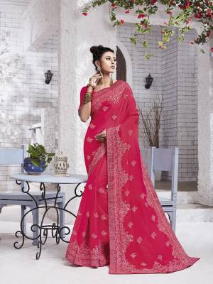 Enhance Your Personality Wearing This Designer Saree In Rani Pink Color. This Pretty Resham Embroidered Saree Is Fabricated On Chiffon Paired With Art Silk Fabricated Blouse. It Is Highlited With Pretty Stone Work Which Gives An Attractive Yet Elegant Look. 