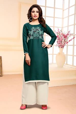 Add This Designer Dress Material In Teal Green colored Top Paired With White Colored Bottom. Its Top Is cotton Based Paired With Muslin Bottom. Buy This Pretty Thread Embroidered Dress Material Now.