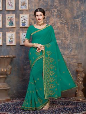 For Your Semi-Casual Wear, Grab This Pretty Saree In Sea Green Color. This Saree And Blouse Are Georgette Based With A Minimal Of Embroidery Work With Jari And Tone To Tone Resham.