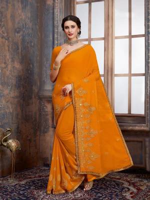For Your Semi-Casual Wear, Grab This Pretty Saree In Musturd Yellow Color. This Saree And Blouse Are Georgette Based With A Minimal Of Embroidery Work With Jari And Tone To Tone Resham.