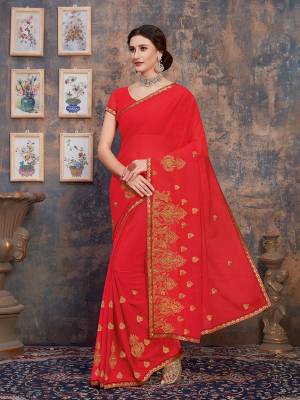 For Your Semi-Casual Wear, Grab This Pretty Saree In Crimson Red Color. This Saree And Blouse Are Georgette Based With A Minimal Of Embroidery Work With Jari And Tone To Tone Resham.