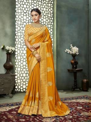 Grab This Pretty Attractive Saree In Musturd Yellow Color. This Saree?Is Fabricated On Art Silk Paired With Brocade Fabricated Blouse. It Has Attractive Jari Embroidered Motifs With Detailed Weaved Broad Border. Its Rich Fabric And Color Will Earn You Lots Of Compliments From Onlookers.