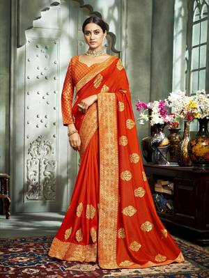 Celebrate This Festive Season With Beauty And Comfort Wearing This Durable And Light Weight Designer Saree In Orange Color. This Saree Is Fabricated On Art Silk Paired With Brocade Fabricated Blouse. Buy Now.