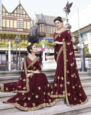 Celebrate This Festive Season With Beauty And Comfort Wearing This Durable And Light Weight Designer Saree In Maroon Color. This Saree Is Fabricated On Art Silk Paired With Jacquard Silk Fabricated Blouse. Buy Now