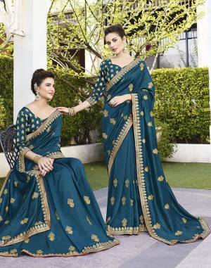 Grab This Pretty Attractive Saree In Blue Color. This Saree Is Fabricated On Art Silk Paired With Jacquard Silk Fabricated Blouse. It Has Attractive Jari Embroidered Motifs With Detailed Weaved Broad Border. Its Rich Fabric And Color Will Earn You Lots Of Compliments From Onlookers.