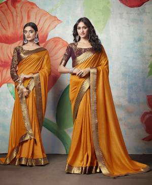 Celebrate This Festive Season With Beauty And Comfort Wearing This Simple And Elegant Looking Designer Saree In Musturd Yellow Color Paired With Contrasting Brown Colored Blouse. This Saree IS Silk Based Paired With Jacquard Silk Fabricated Blouse.