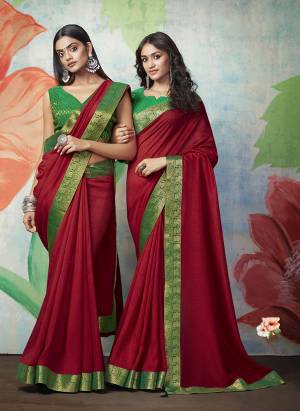 Add Some Rich And Elegant looking Simple Yet Designer Saree In Maroon Color Paired With Contrasting Green Colored Blouse. This Saree Is Fabricated On Art Silk Paired with Jacquard Silk Fabricated Blouse. Buy Now.