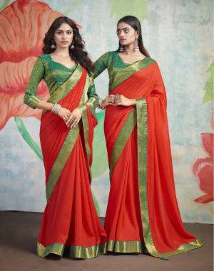 Add Some Rich And Elegant looking Simple Yet Designer Saree In Red Color Paired With Contrasting Green Colored Blouse. This Saree Is Fabricated On Art Silk Paired with Jacquard Silk Fabricated Blouse. Buy Now.