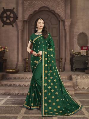 Look Pretty In This Elegant Butti Embroidered Designer Saree In Green Color. This Pretty Saree Is Fabricated On Satin Chiffon Beautified With Jari Embroidered Pretty Motifs All Over. It Is Light Weight, Durable And Easy To Carry All Day Long. 