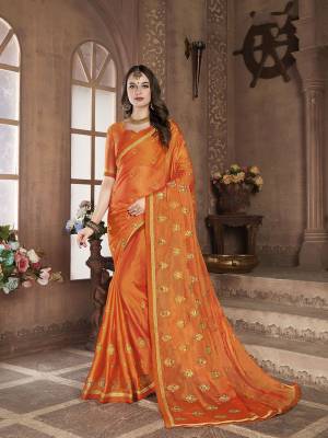 Look Pretty In This Elegant Butti Embroidered Designer Saree In Orange Color. This Pretty Saree Is Fabricated On Satin Chiffon Beautified With Jari Embroidered Pretty Motifs All Over. It Is Light Weight, Durable And Easy To Carry All Day Long. 