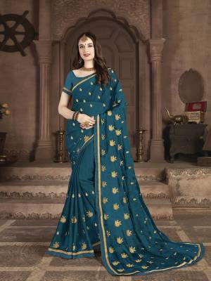 Celebrate This Festive Season With Beauty and Comfort In This Lovely Designer Saree In Cobalt Blue color. This Saree And Blouse Are Satin Chiffon Based Beautified With Jari Embroidered Motifs. 