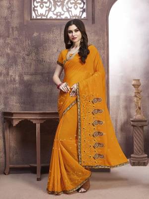 Celebrate This Festive Season With Beauty And Comfort Wearing This Pretty Elegant Designer Saree In Musturd Yellow Color. This Saree And Blouse Are Fabricated On Georgette Beautified With Jari Embroidery And Thread Work.
