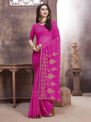 Celebrate This Festive Season With Beauty And Comfort Wearing This Pretty Elegant Designer Saree In Rani Pink Color. This Saree And Blouse Are Fabricated On Georgette Beautified With Jari Embroidery And Thread Work.